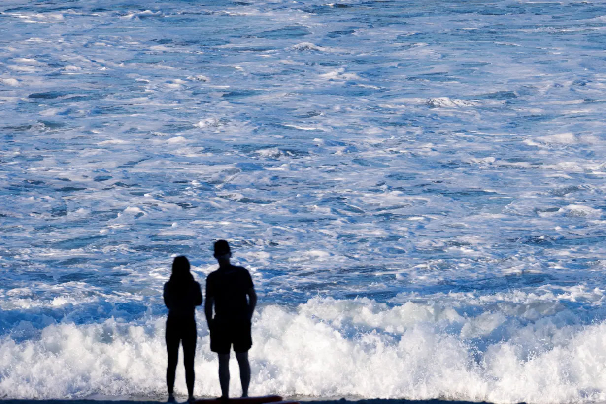 FILE PHOTO: Waves come ashore at Moonlight Beach in California