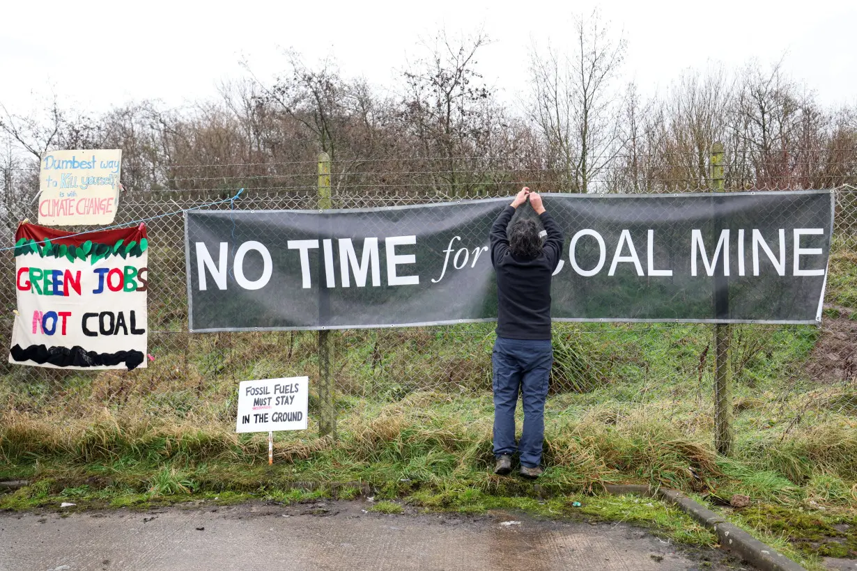 Activists protest at the site of a future coal mine, in Whitehaven