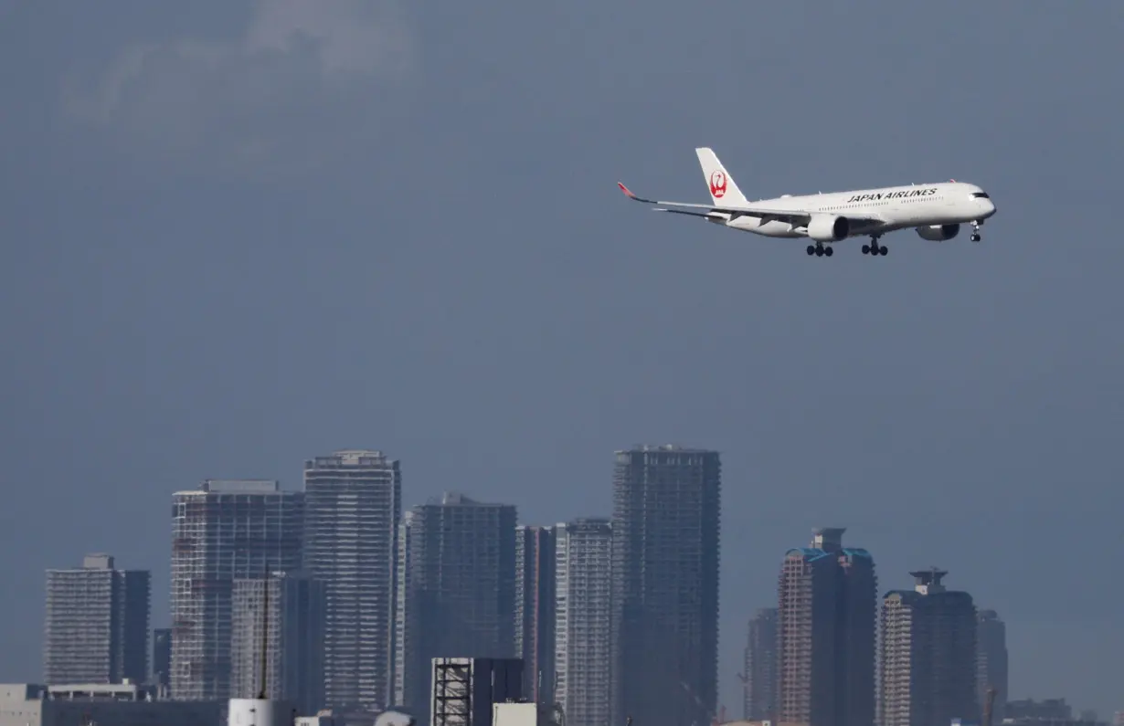 A Japan Airlines (JAL) aircraft approaches to land at Haneda Airport in Tokyo