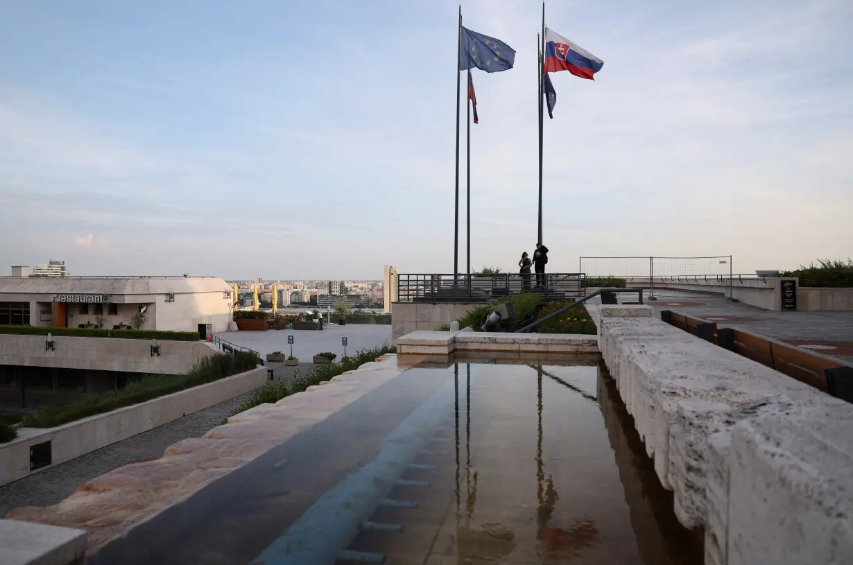 EU and Slovak flags are reflected in Bratislava