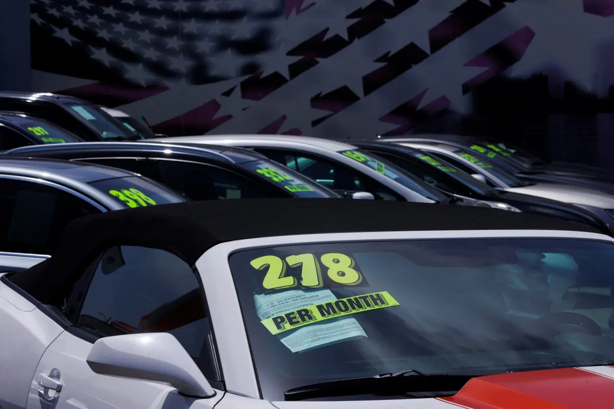 Cars are shown for sale at a car lot in California