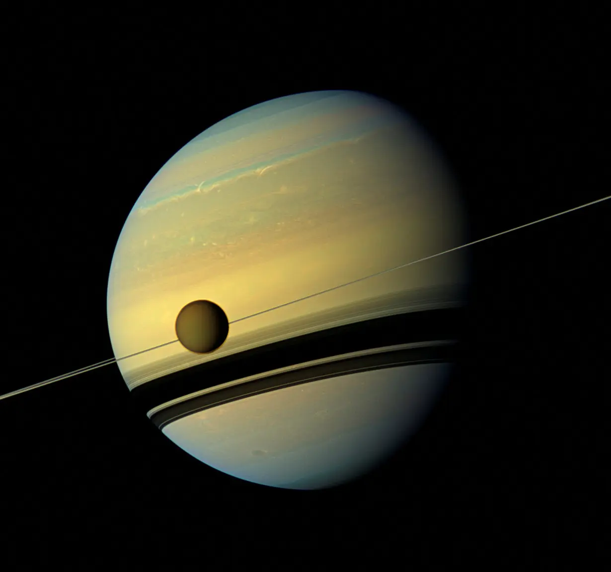 FILE PHOTO: Handout of Titan, Saturn's largest moon in this natural color view from NASA's Cassini spacecraft