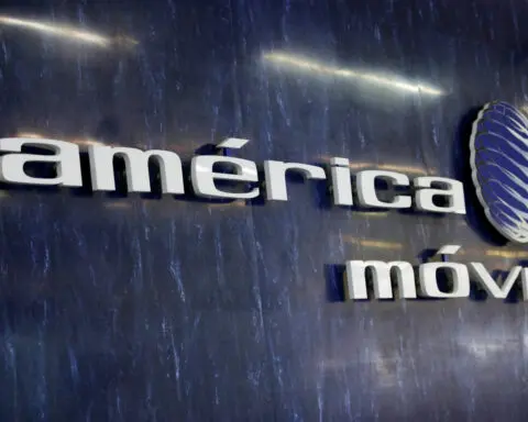 America Movil swings to net loss citing post-election peso volatility