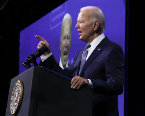 Biden pledges 'I am all in,' criticizes Trump on policy