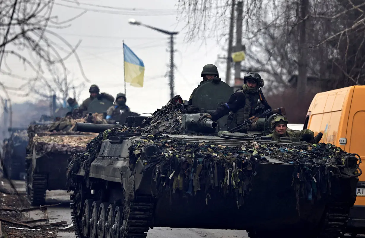 FILE PHOTO: Ukrainian soldiers are pictured in their tanks, amid Russia's invasion on Ukraine, in Bucha, in Kyiv region