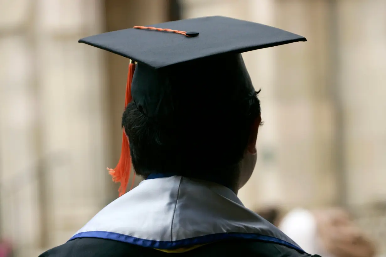 A student attends a graduation ceremony in Los Angeles, California