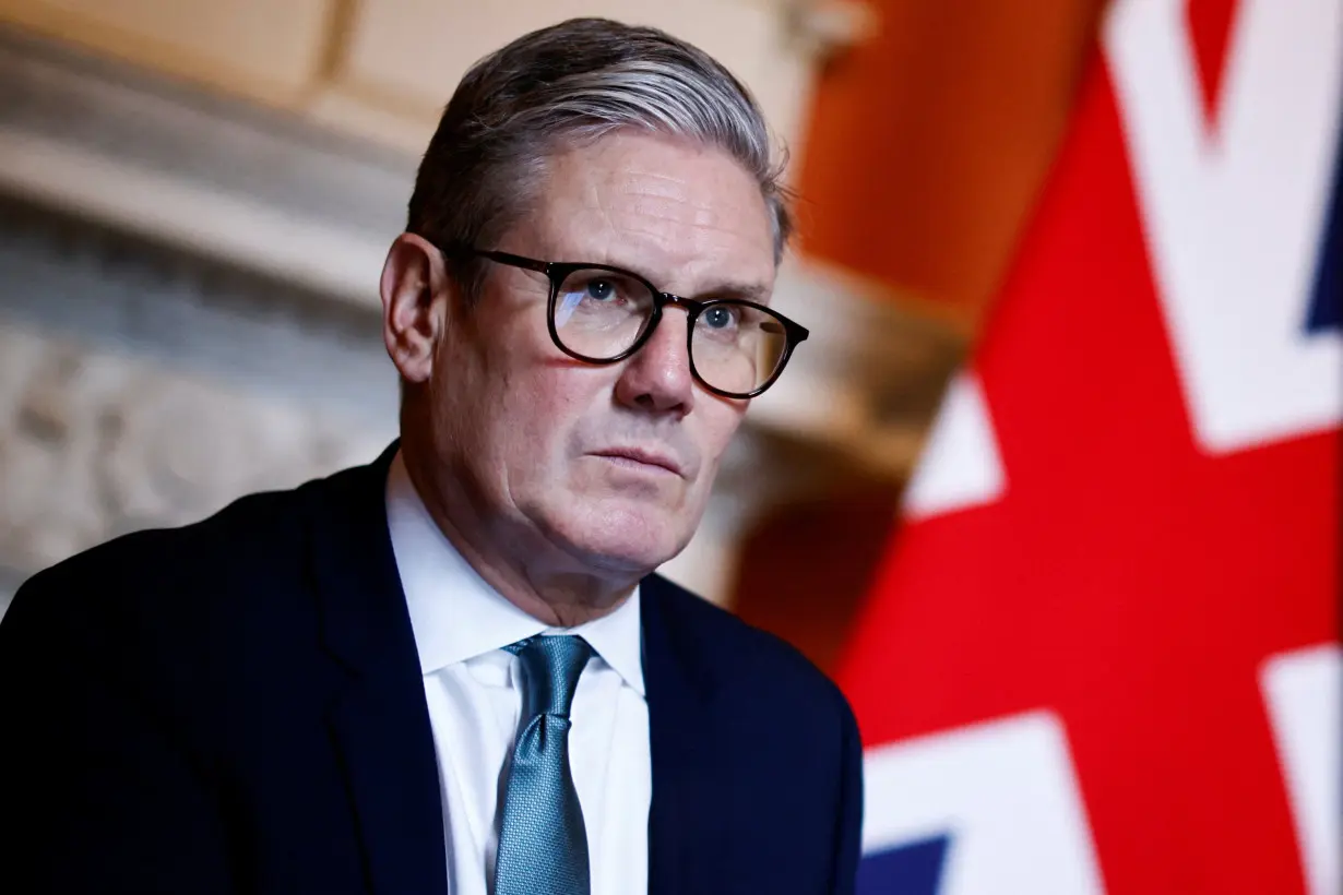 Britain's PM Keir Starmer meets Defence Secretary John Healey and Member of the House of Lords George Robertson at 10 Downing Street, in London