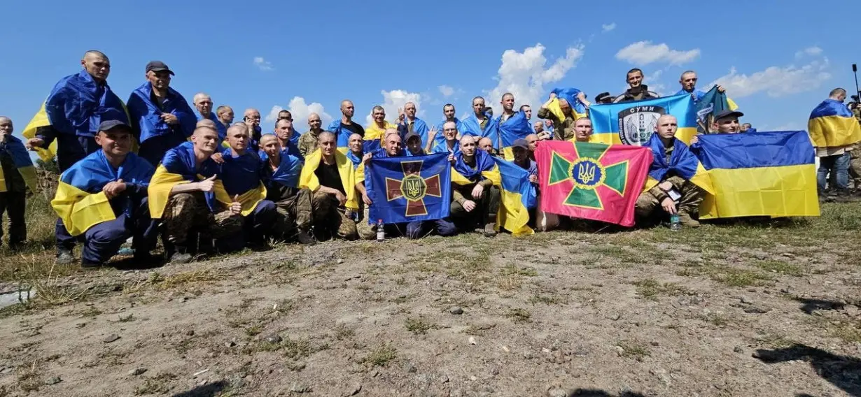 Ukrainian POWs are seen after a swap at an unknown location in Ukraine