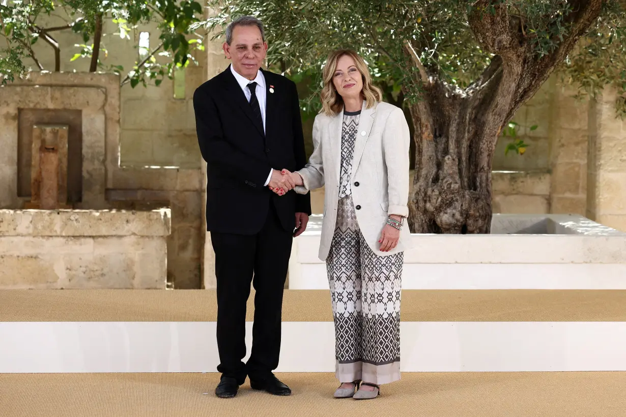 FILE PHOTO: Tunisia's Prime Minister Ahmed Hachani is welcomed by Italian Prime Minister Giorgia Meloni on the second day of a G7 summit in Italy