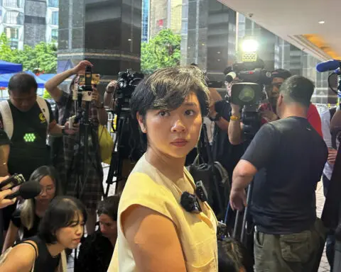 The head of Hong Kong's leading journalist group says she lost WSJ job after refusing to drop role