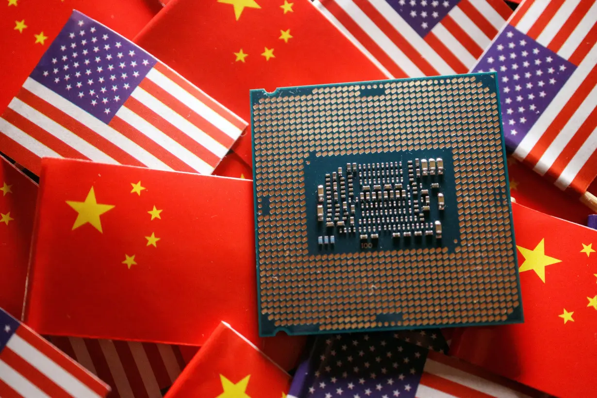 FILE PHOTO: Illustration picture of Chinese and U.S. flags with semiconductor chip