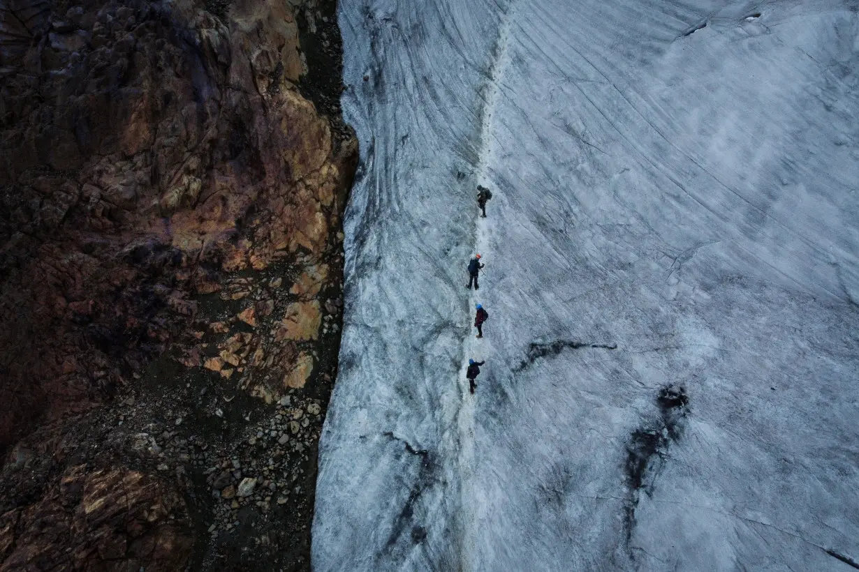 The Wider Image: In the Andes, mountain guides bear witness to shrinking glaciers