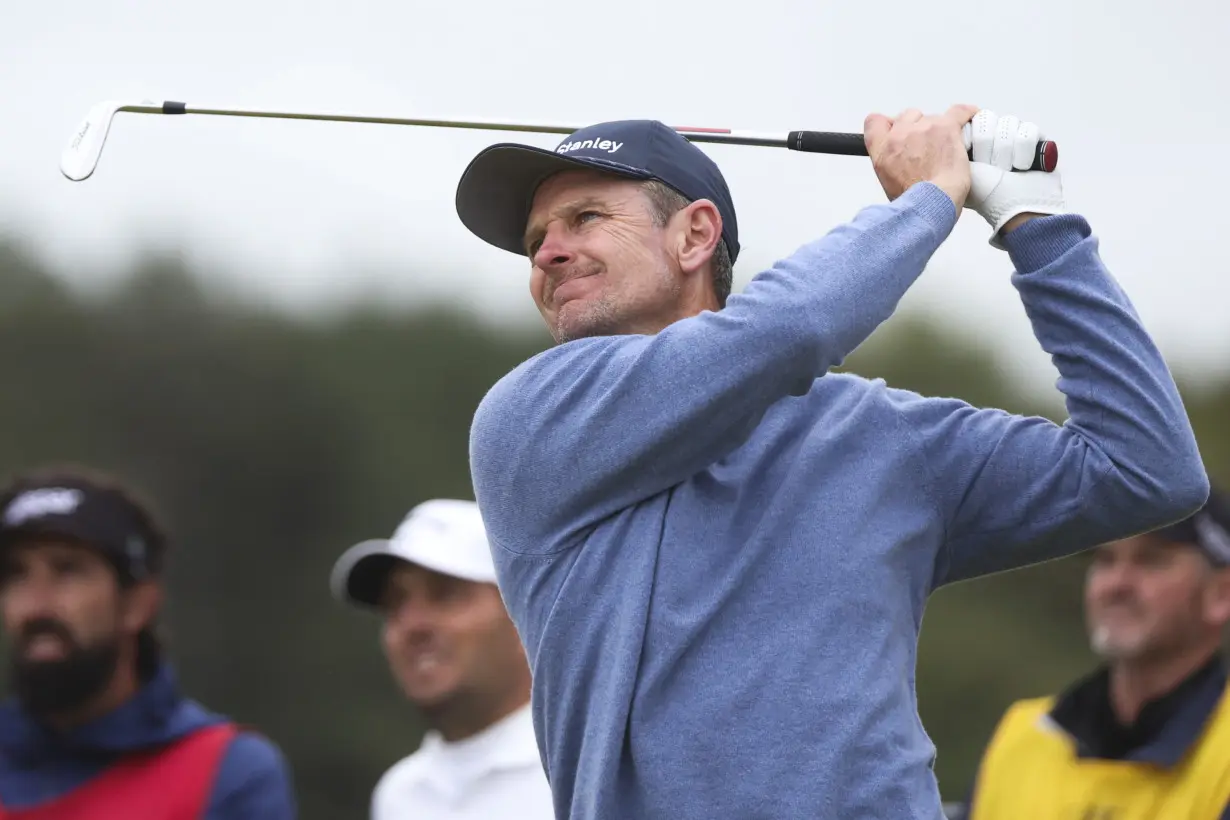 Daniel Brown makes late birdies for a 1-shot lead over Shane Lowry in wind-challenged British Open