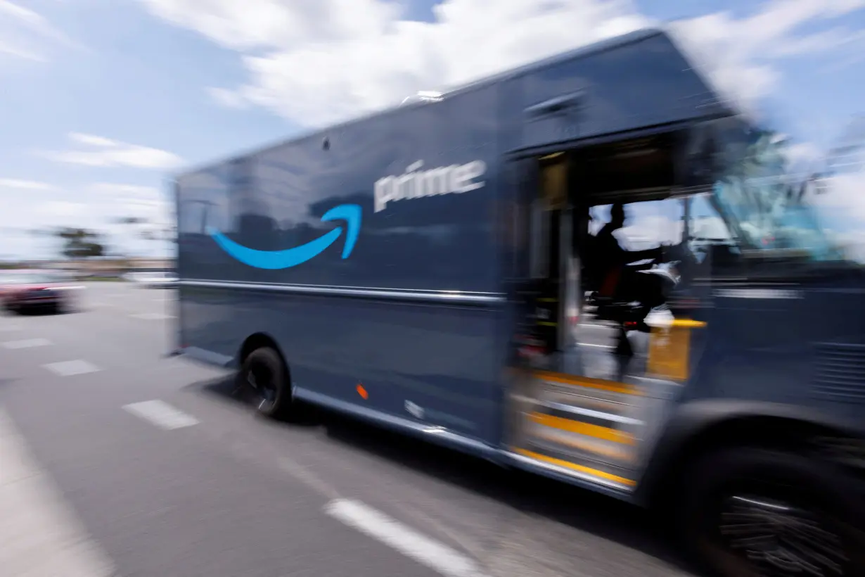 FILE PHOTO: Amazon Prime delivery van is driven along a street in California