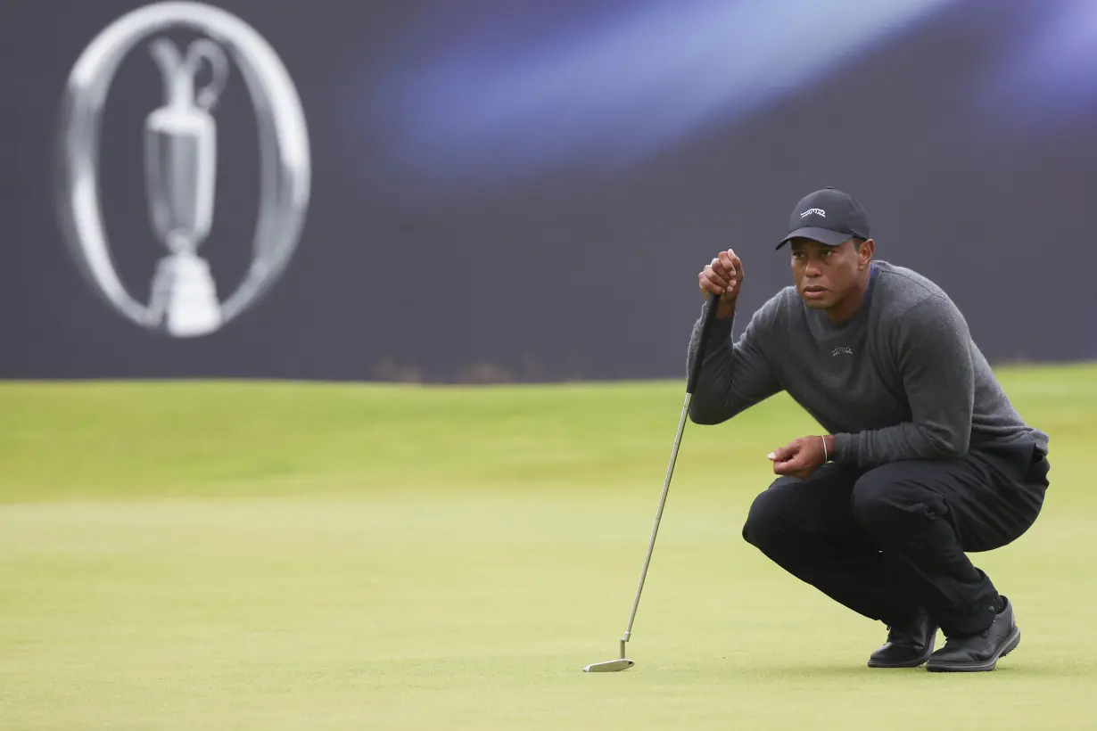 Daniel Brown makes late birdies for a 1-shot lead over Shane Lowry in wind-challenged British Open