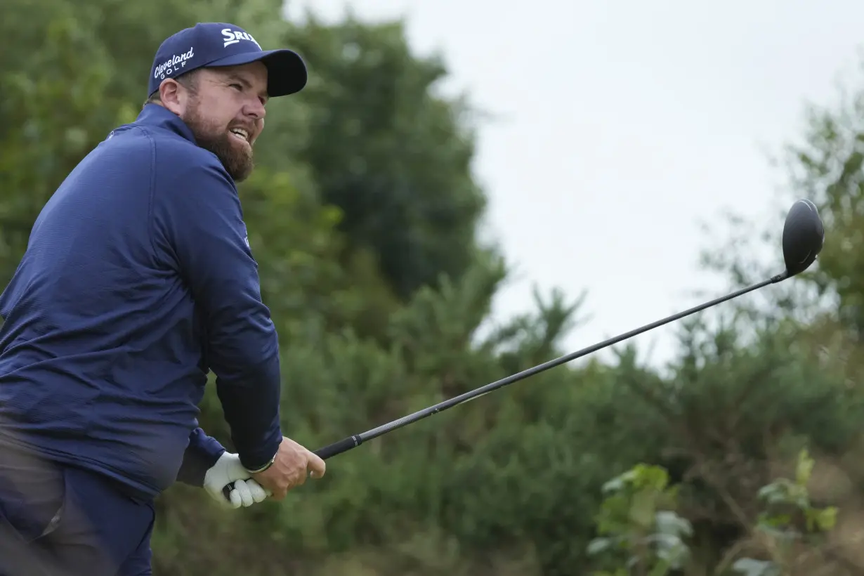 Daniel Brown makes late birdies for a 1-shot lead over Shane Lowry in wind-challenged British Open