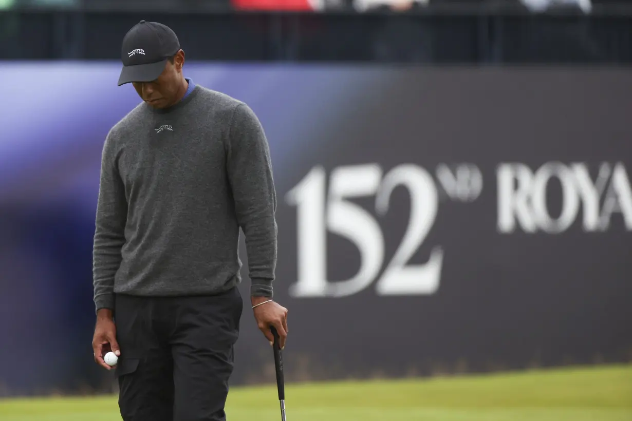 Daniel Brown makes late birdies for a 1-shot lead over Shane Lowry in wind-challenged British Open