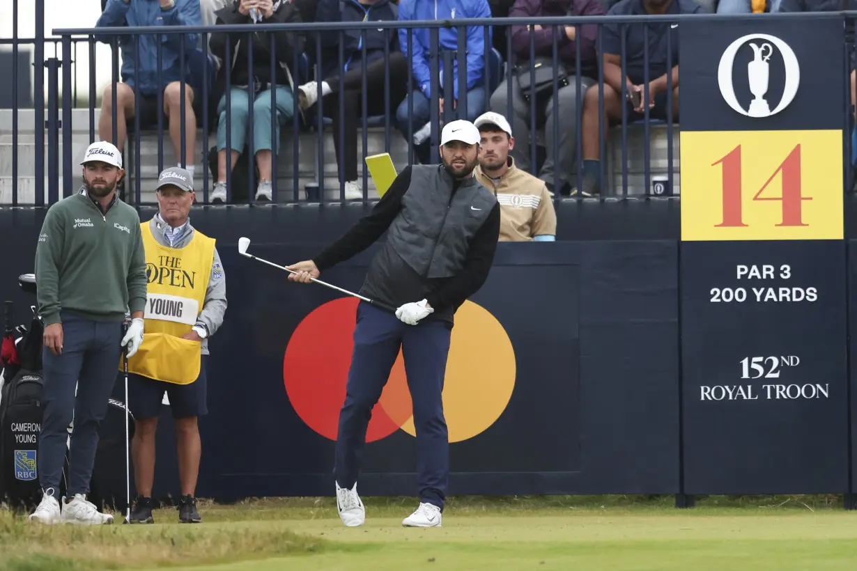 Daniel Brown makes late birdies for a 1-shot lead over Shane Lowry in wind-challenged British Open