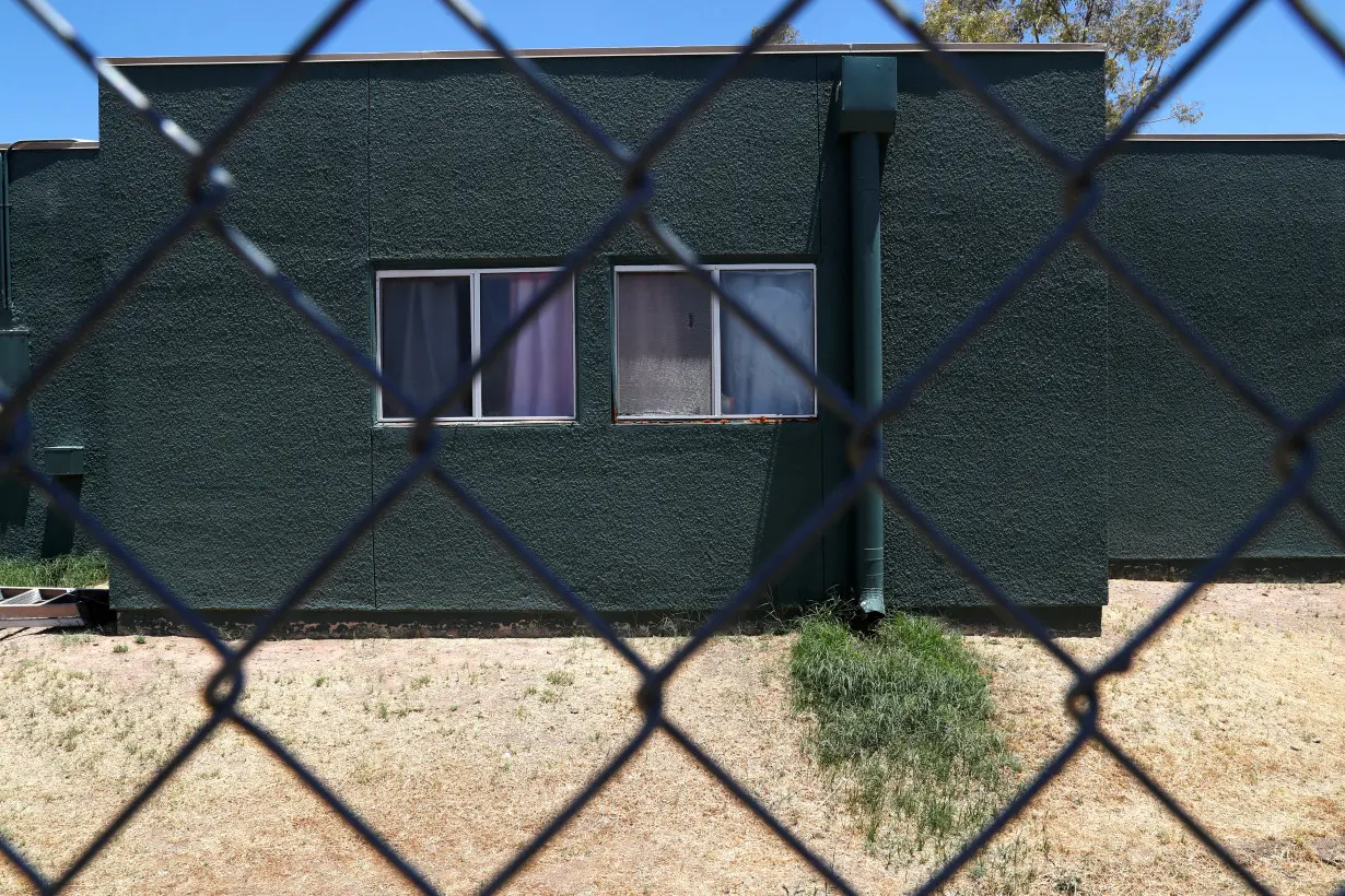 FILE PHOTO: Windows are seen at facilities behind fencing as U.S. first lady tours immigration detention facility for children in Phoenix, Arizona