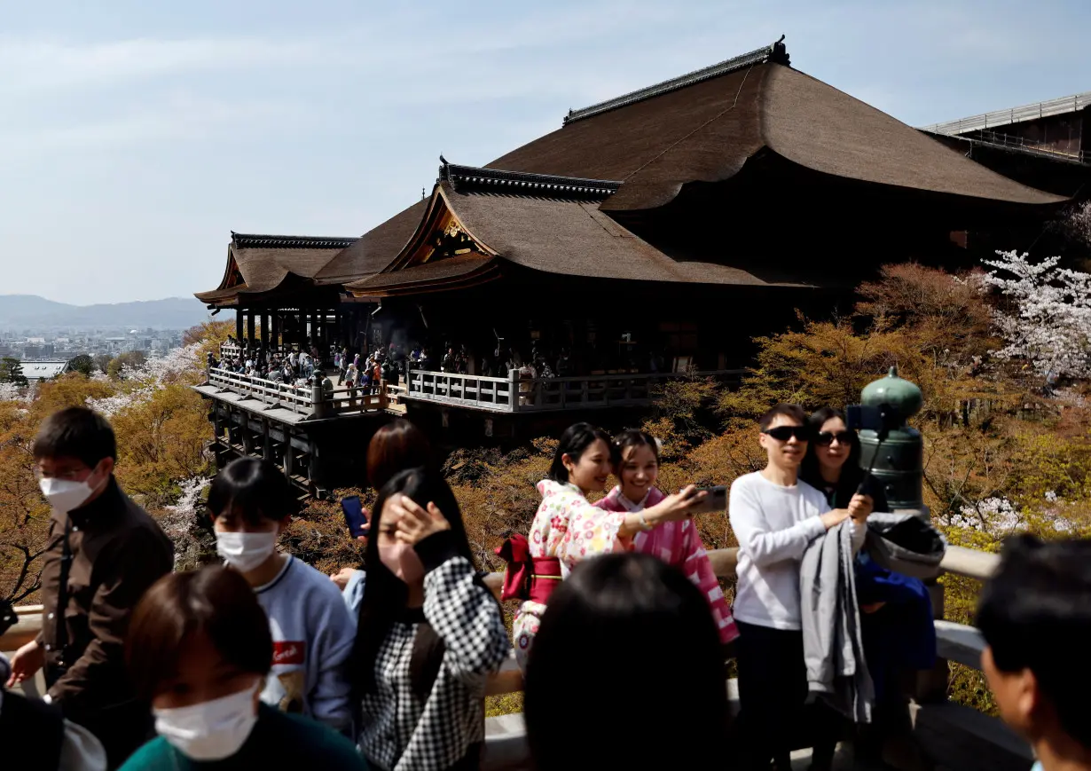 FILE PHOTO: A crowd of tourists are seen at Kiyomizu-dera temple in Kyoto