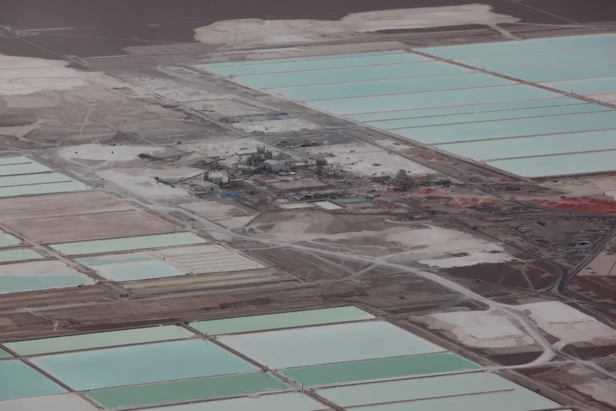 An aerial view shows the brine pools of SQM lithium mine on the Atacama salt flat in the Atacama desert of northern Chile