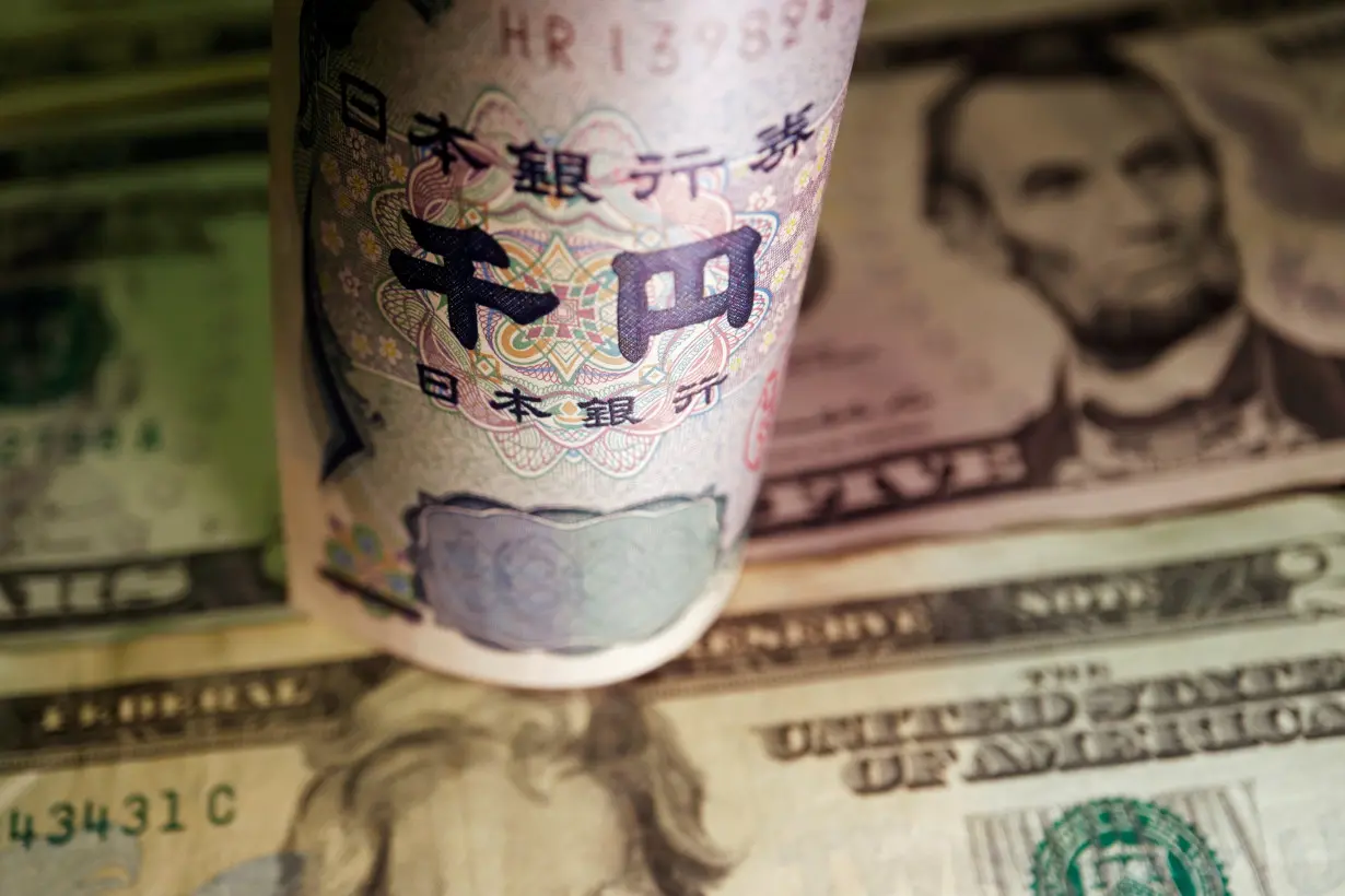 Illustration picture of Japanese yen and U.S. dollar banknotes