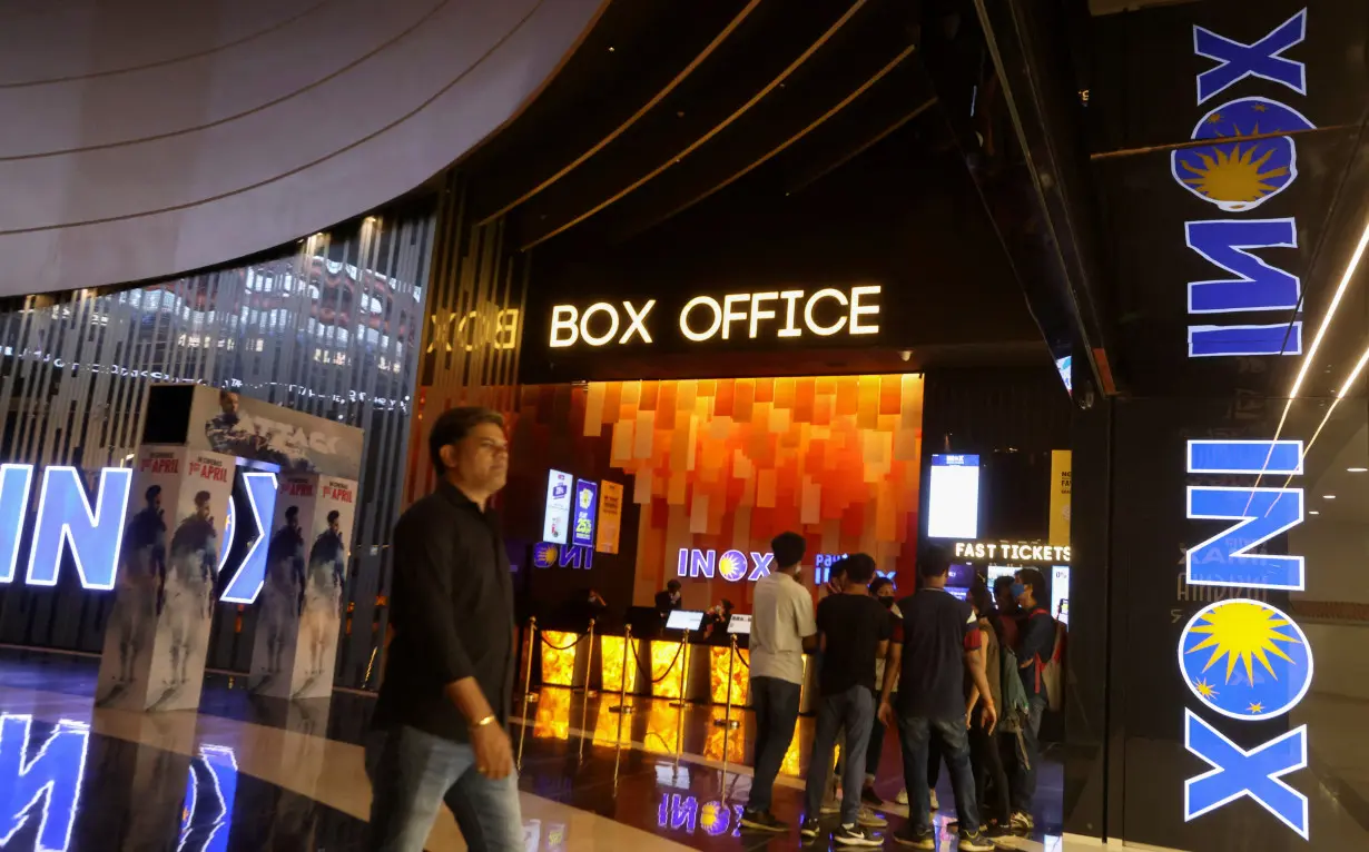 FILE PHOTO: People visit an INOX movie theatre in Mumbai