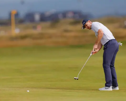 Golf-Rose loving the grind as he scents Open title chance