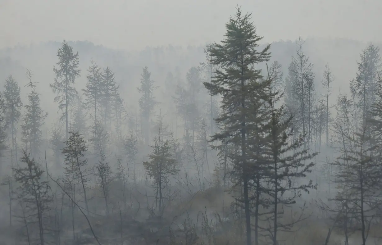 Firefighters in Russian Yakutia struggle to tackle wildfires amid latest hot summer