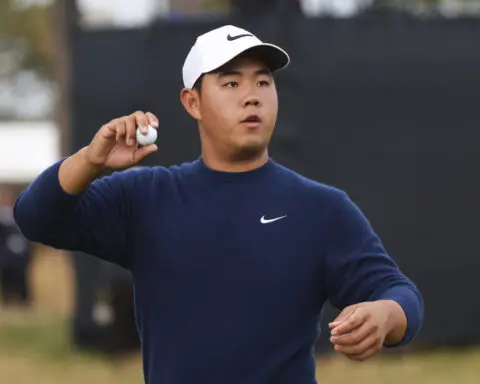 Shane Lowry keeps calm and carries British Open lead at Troon