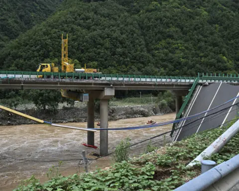 11 dead and dozens missing after a highway bridge in China crumbles in flooding and heavy storms