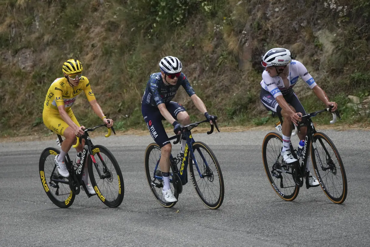 Pogacar edges Vingegaard to add more seconds to Tour de France lead and match a 76-year-old mark