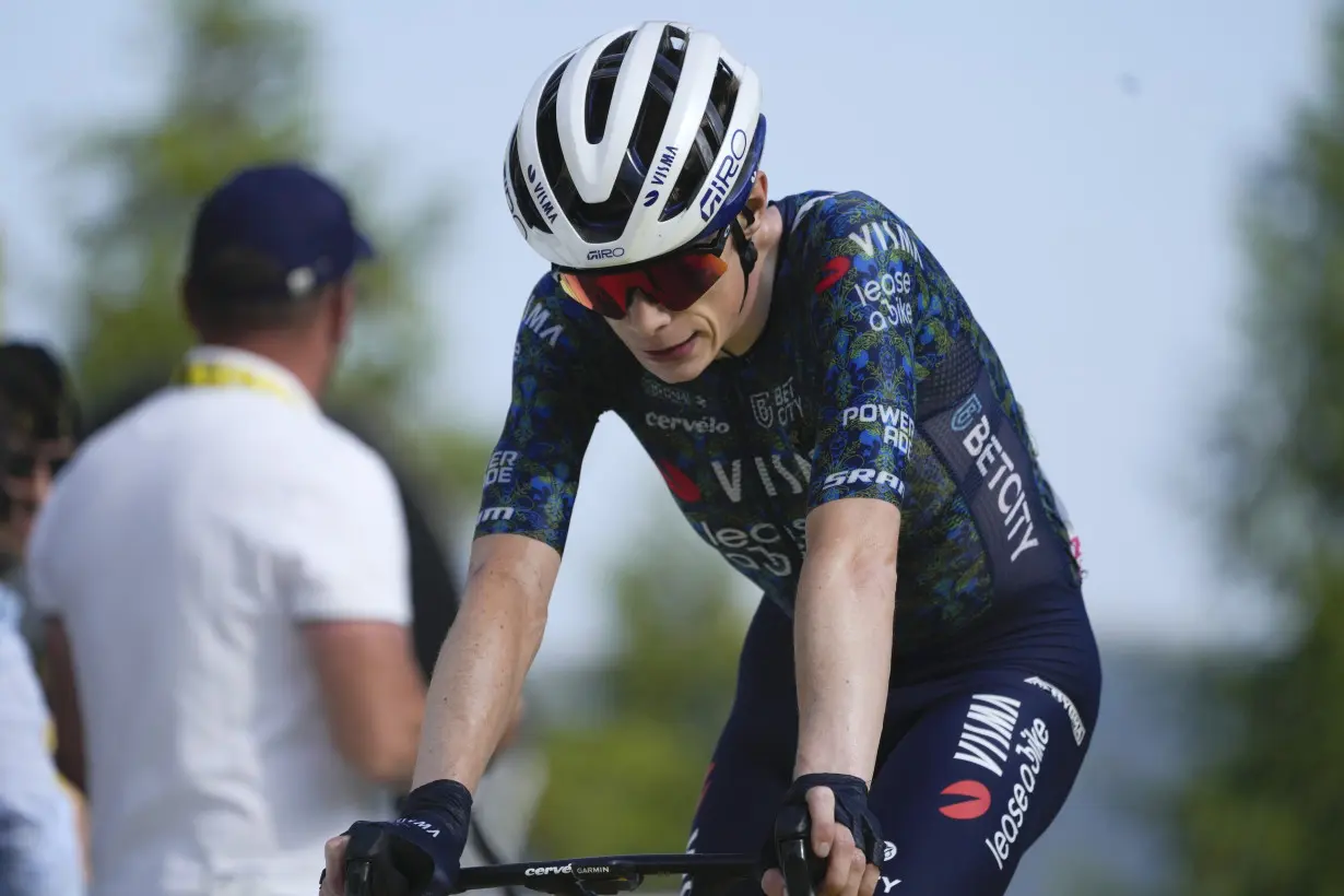 Pogacar edges Vingegaard to add more seconds to Tour de France lead and match a 76-year-old mark