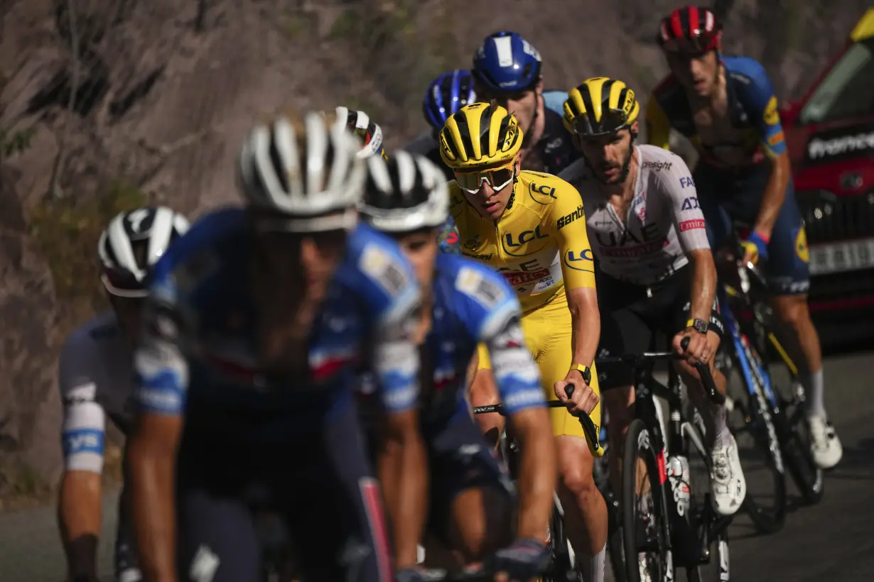 Pogacar edges Vingegaard to add more seconds to Tour de France lead and match a 76-year-old mark