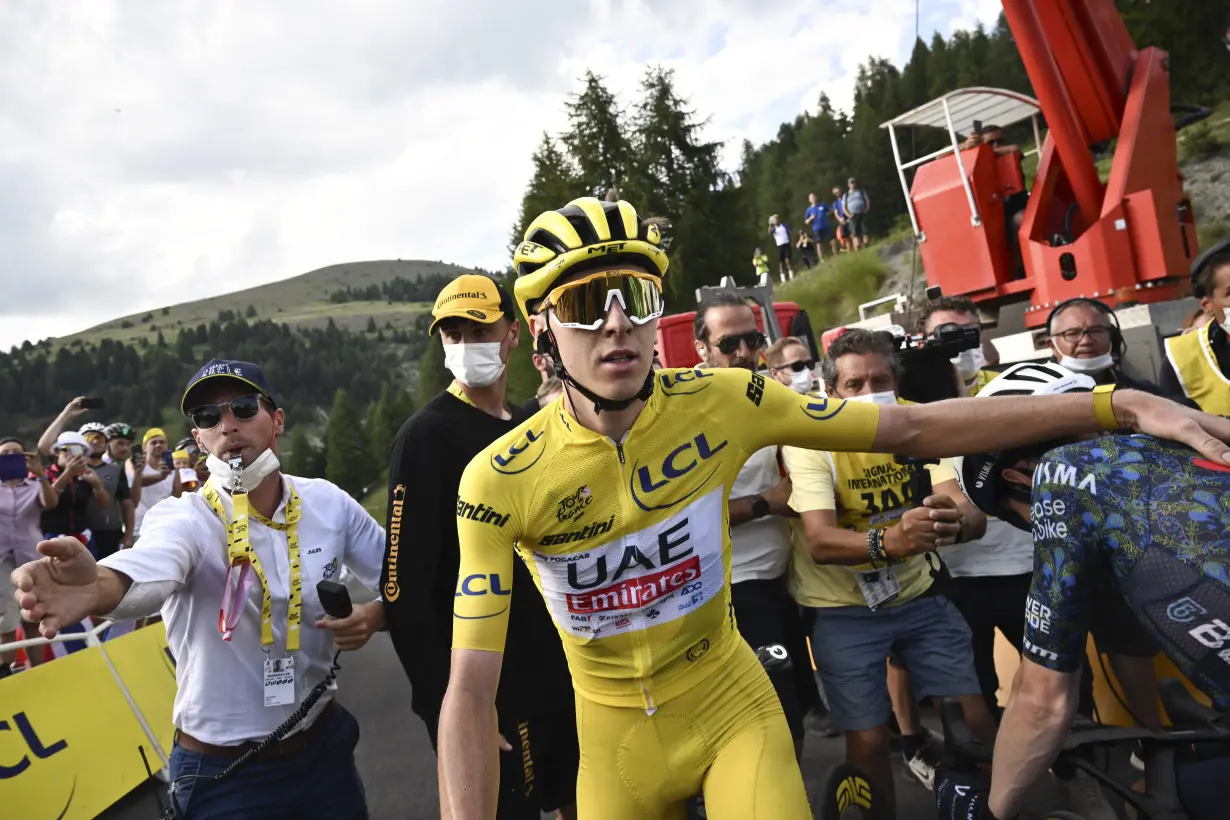 Pogacar edges Vingegaard to add more seconds to Tour de France lead and match a 76-year-old mark