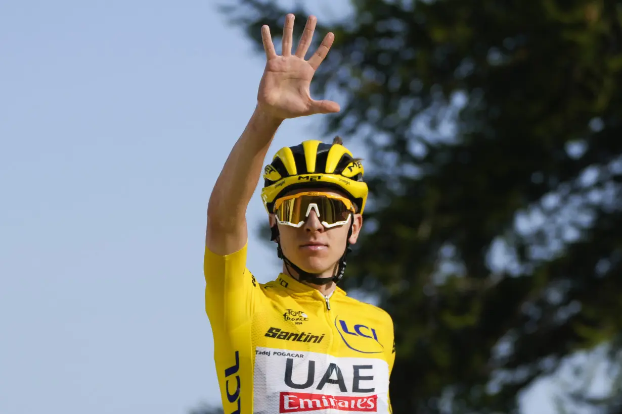 Pogacar edges Vingegaard to add more seconds to Tour de France lead and match a 76-year-old mark