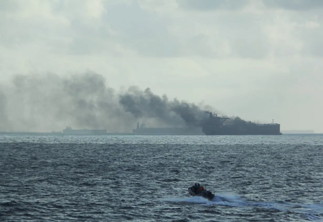 Rescue teams reach oil tankers on fire off the Singaporean island of Pedra Branca