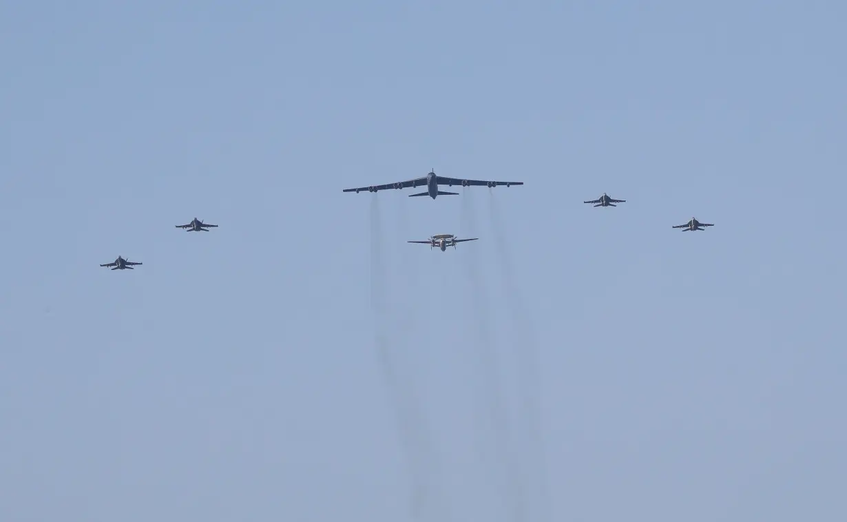 United States aircraft carrier Abraham Lincoln (CVN 72) and a U.S. Air Force B-52H Stratofortress, deployed to the region, conduct joint exercises in Arabian Sea