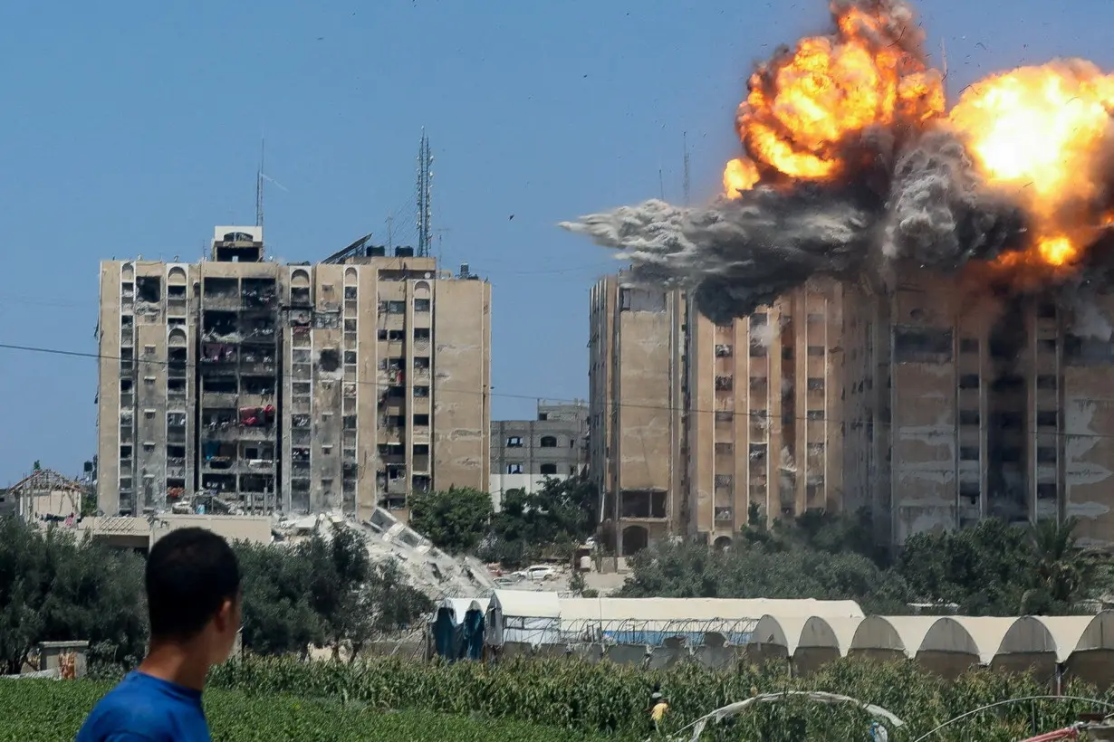 Explosion following an Israeli air strike on a residential building, amid the Israel-Hamas conflict, in Nuseirat