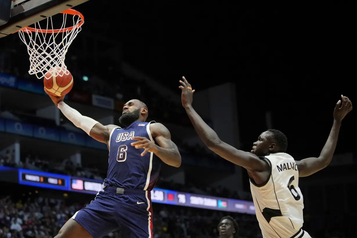 Los Angeles Lakers star LeBron James drives to the basket against South Sudan.