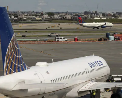 Delta Air Lines says cancellations continue as it tries to restore operations after tech outage