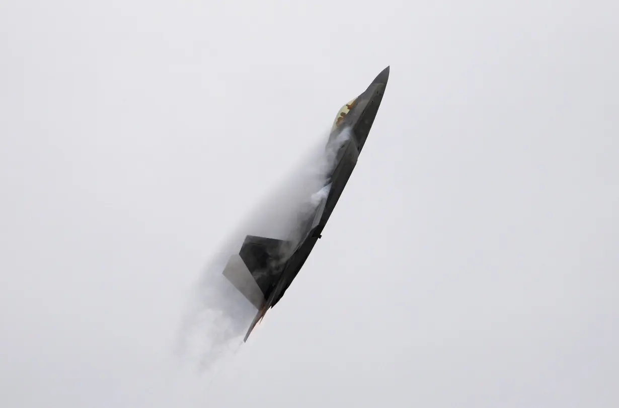 FILE PHOTO: An F-22 Raptor fighter jet performs maneuvers during the California International Airshow in Salinas