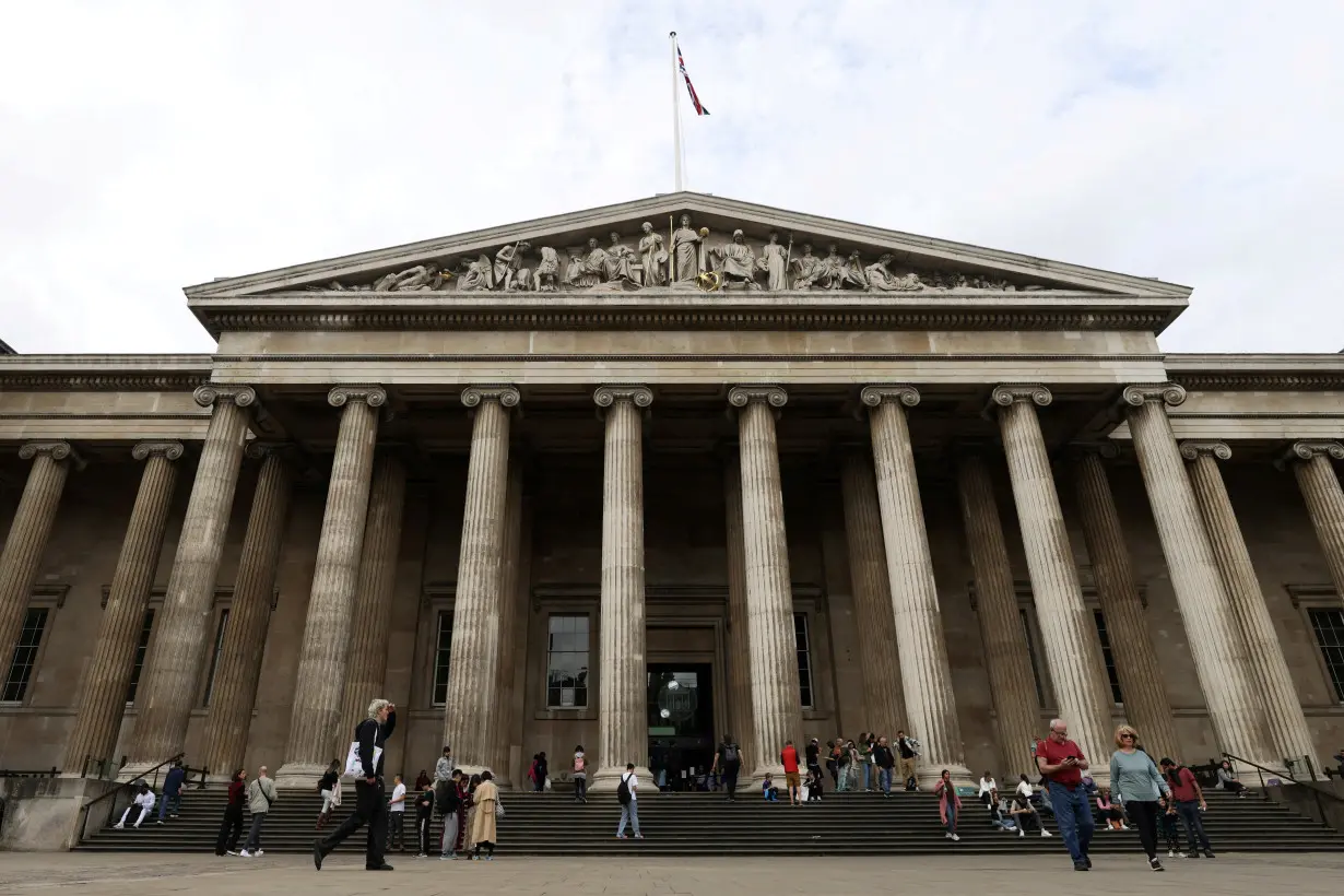 FILE PHOTO: People walk in front of the British Museum in London