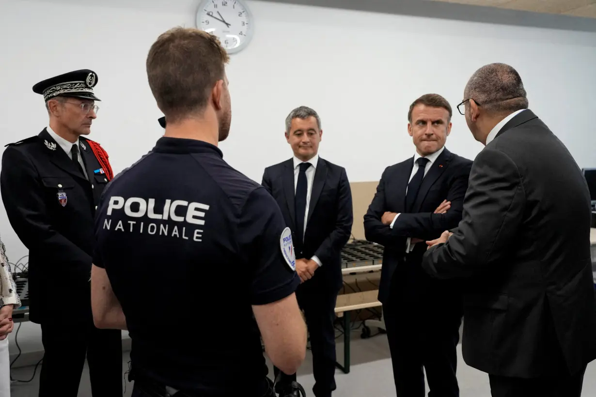 FILE PHOTO: French President Emmanuel Macron visits the Olympic village in Paris