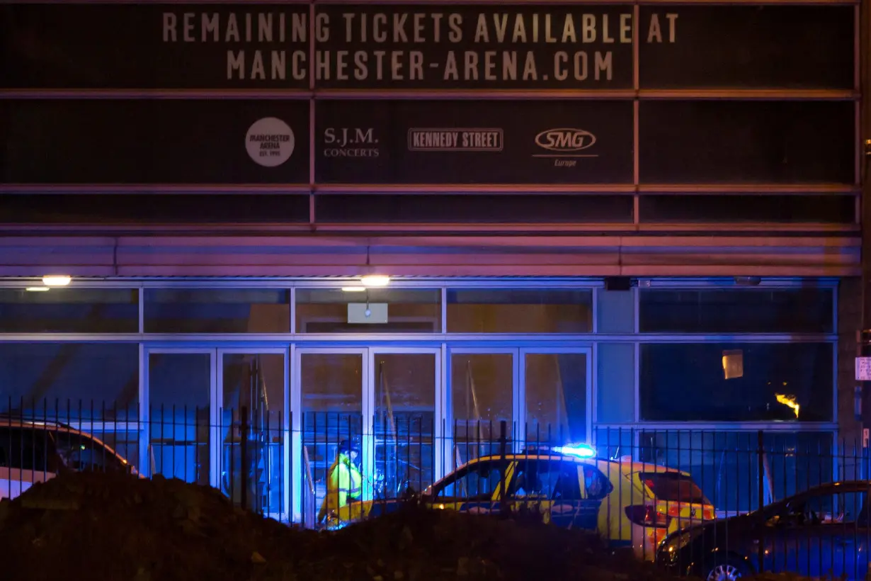 Police are seen outside the Manchester Arena in northern England where U.S. singer Ariana Grande had been performing