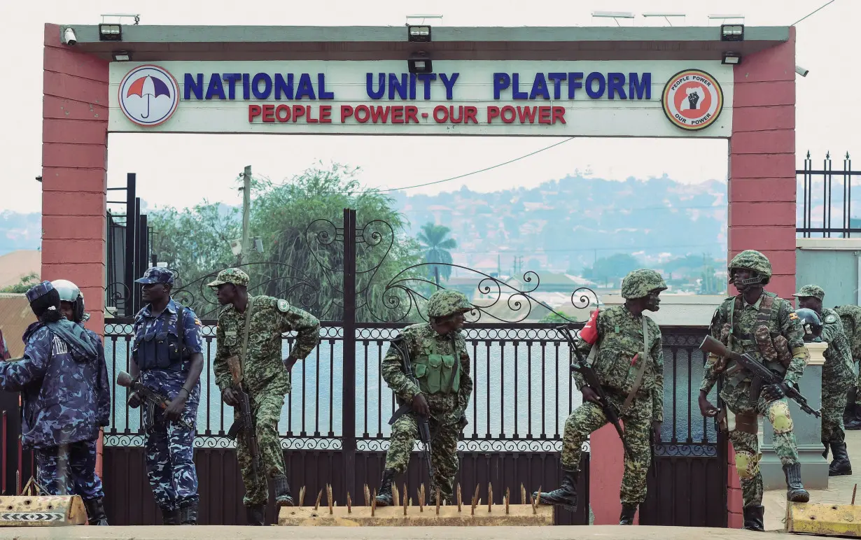 Police and troops block Ugandan opposition NUP's headquarters ahead of protest, in Kampala