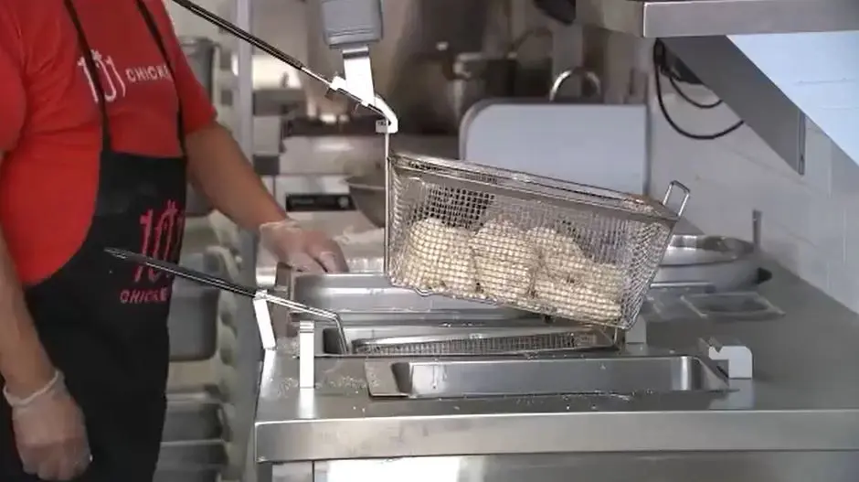 Robot chefs are cooking food at 101 Chicken, a Korean restaurant in Fort Lee, New Jersey