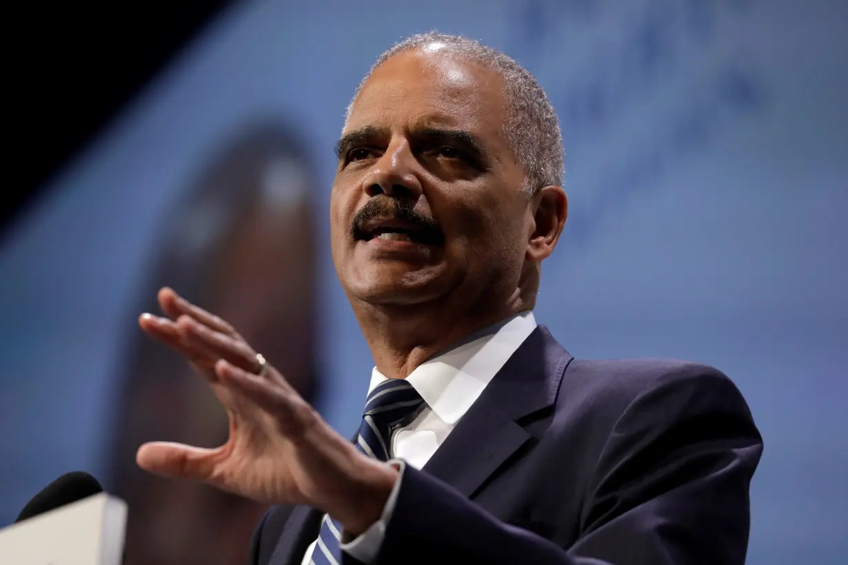 Former U.S. Attorney General Holder addresses the HRC dinner in Washington