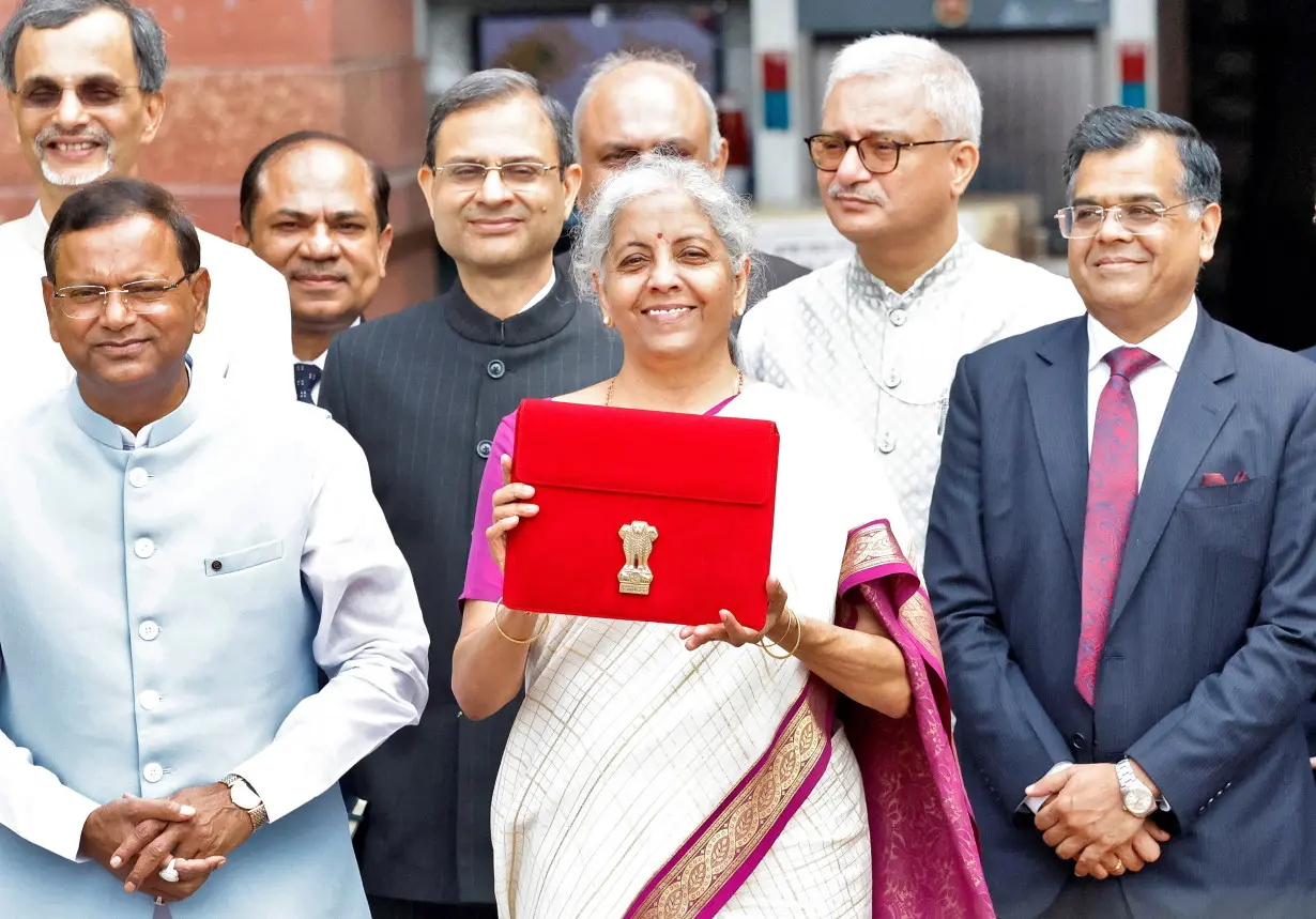 India's Finance Minister Nirmala Sitharaman holds up a folder with the Government of India's logo, in New Delhi