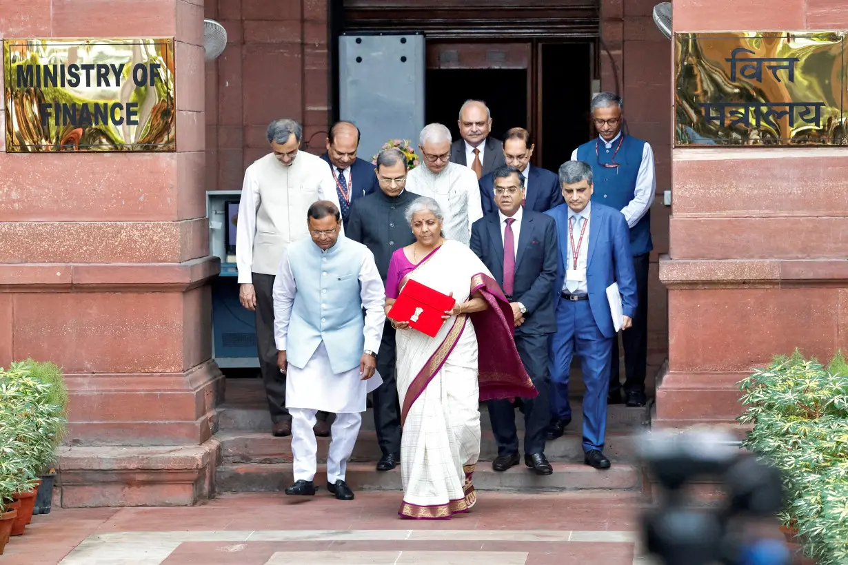 India's Finance Minister Nirmala Sitharaman holds up a folder with the Government of India's logo, in New Delhi